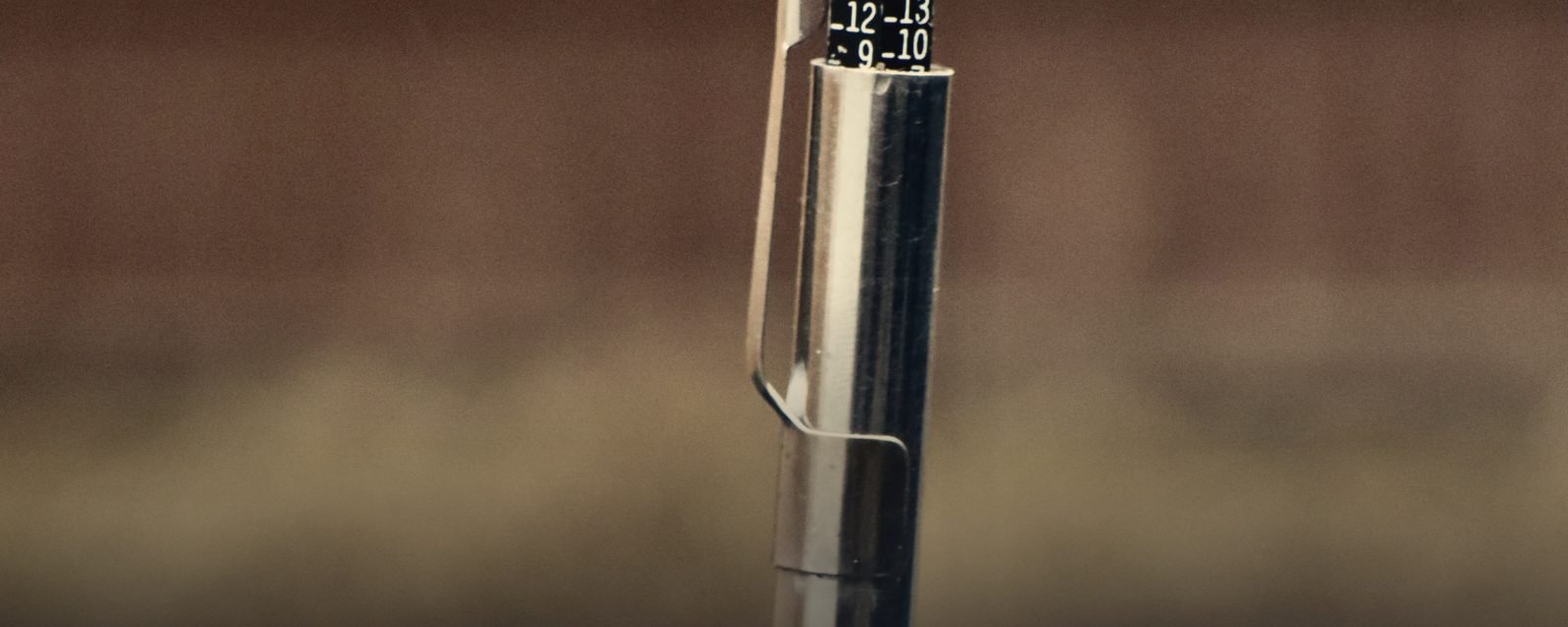 A tread depth gauge measuring a tyre groove